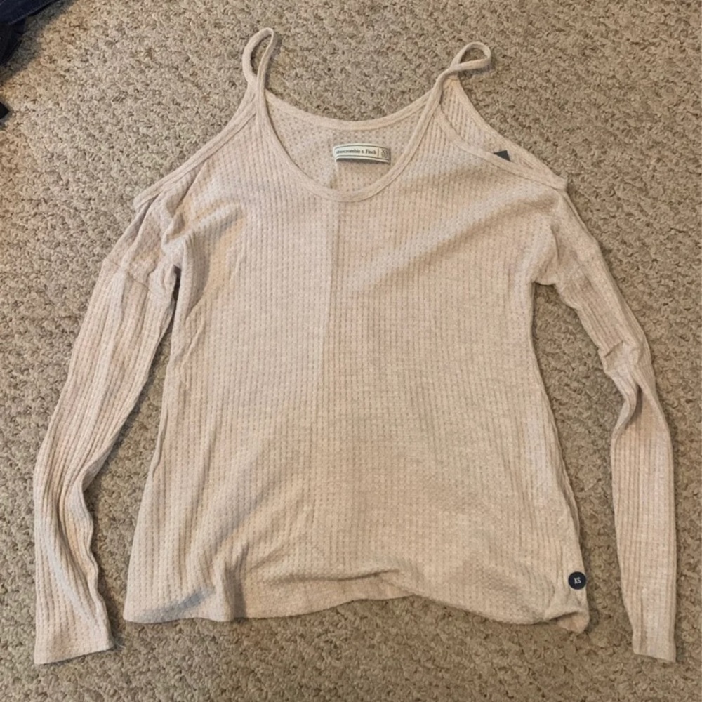 Long sleeve open shoulder shirt. New with tags!